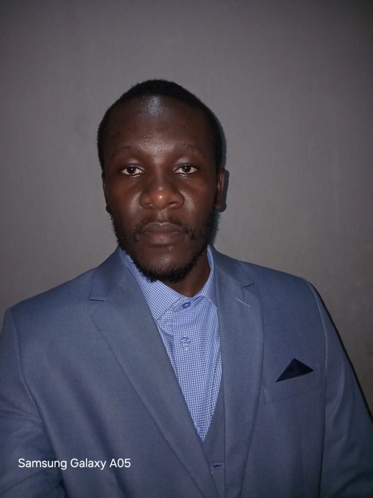 Mayenziwe Mtshali in a blue suit